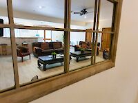 Homely and spacious lounge and bar area within Victoria Albert with featured mirror