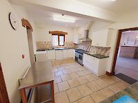 Large kitchen in Victoria Albert with range cooker, tiled floor and everything you need to cater for large groups