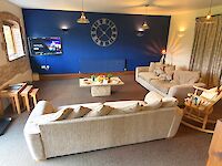 The lovely spacious lounge of Leopold with the feature wall in Sapphire Salute