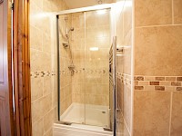 Ensuite shower room, fully tiled throughout
