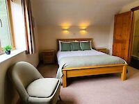 King bedroom with ensuite bathroom in Dorset