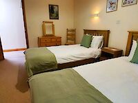 Twin bedroom with ensuite bathroom in Dorset