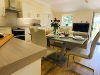 Hollywood kitchen set up for breakfast/dinner with fantastic views towards the open countryside