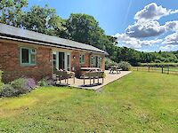 The view towards Hollywood showing their private hot tub and also the wonderful views across the beautiful Dorset countryside