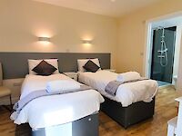Twin beds made up and  just waiting for your arrival