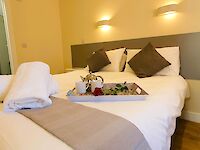 Inviting breakfast in bed in one of the two ensuite bedrooms. Can be made up as king beds or twin beds