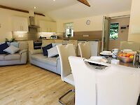 The spacious lounge of Maplewood with open plan kitchen