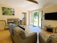 The spacious lounge of Maplewood with open plan kitchen