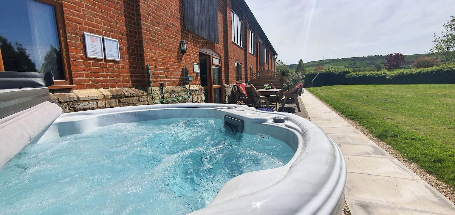 Private hot tub with countryside views at The Victorian Barn Dorset